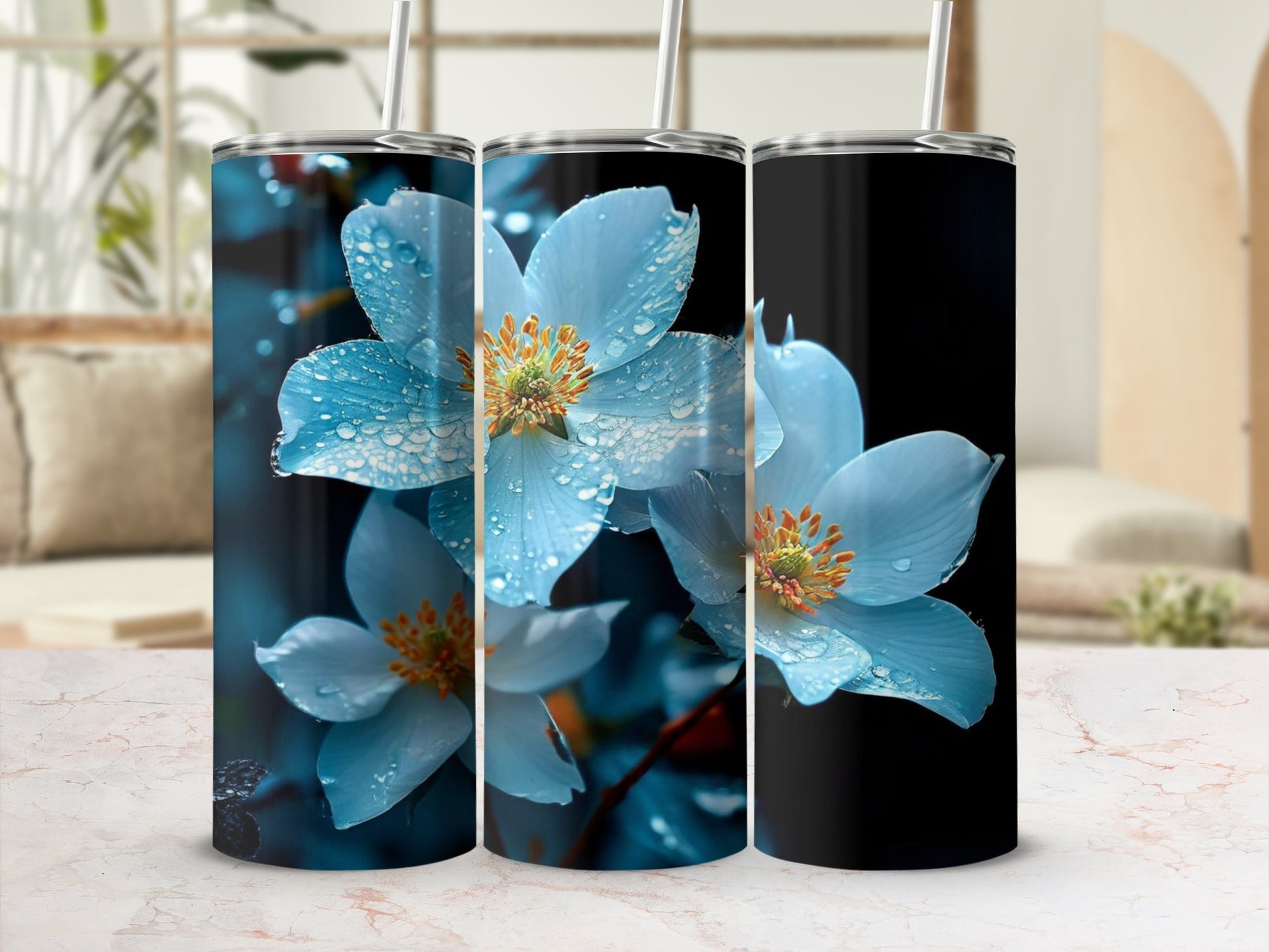 Three tumblers featuring close-up blue flowers with water droplets.