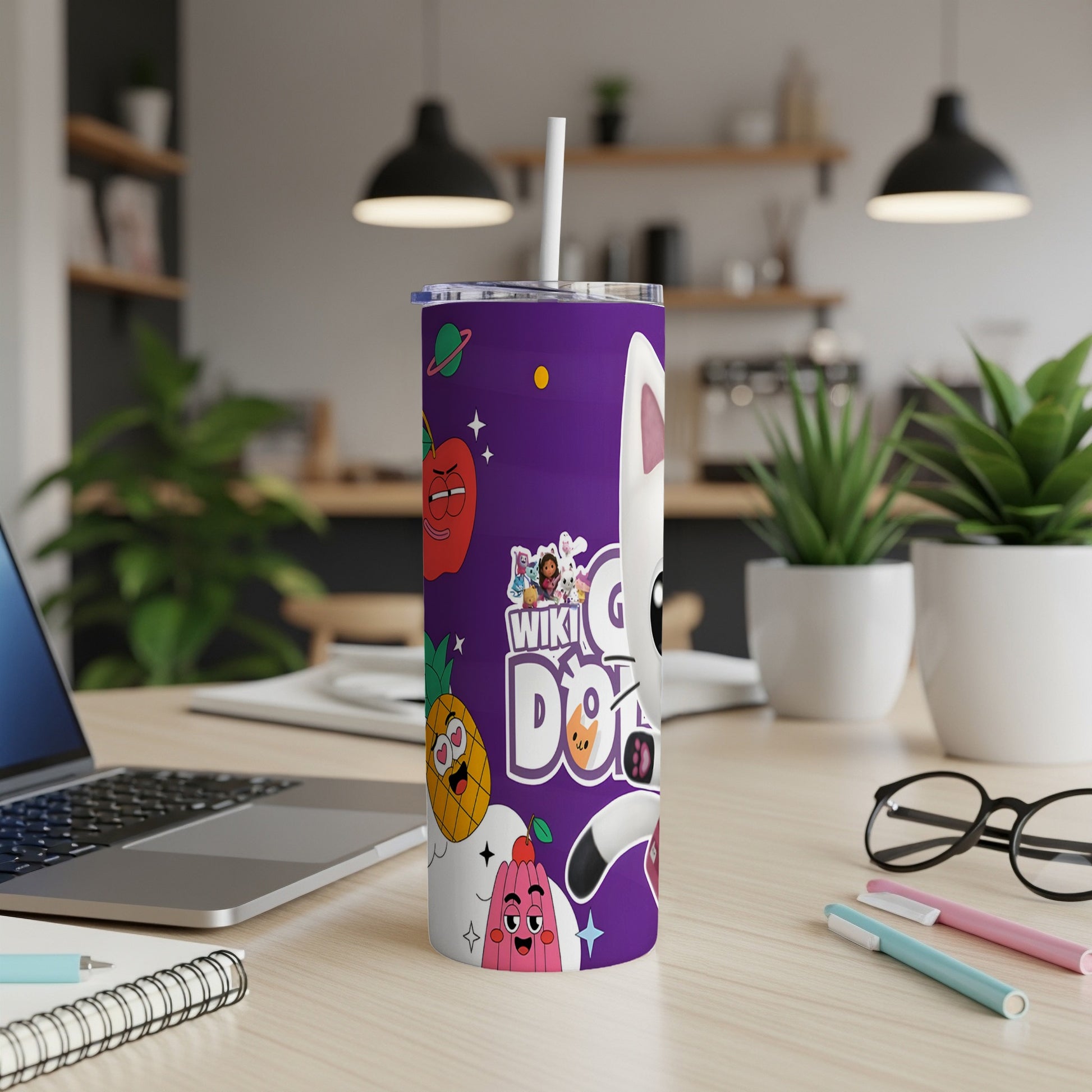Purple tumbler with cartoon characters and "Wiki Dot" logo on a desk.