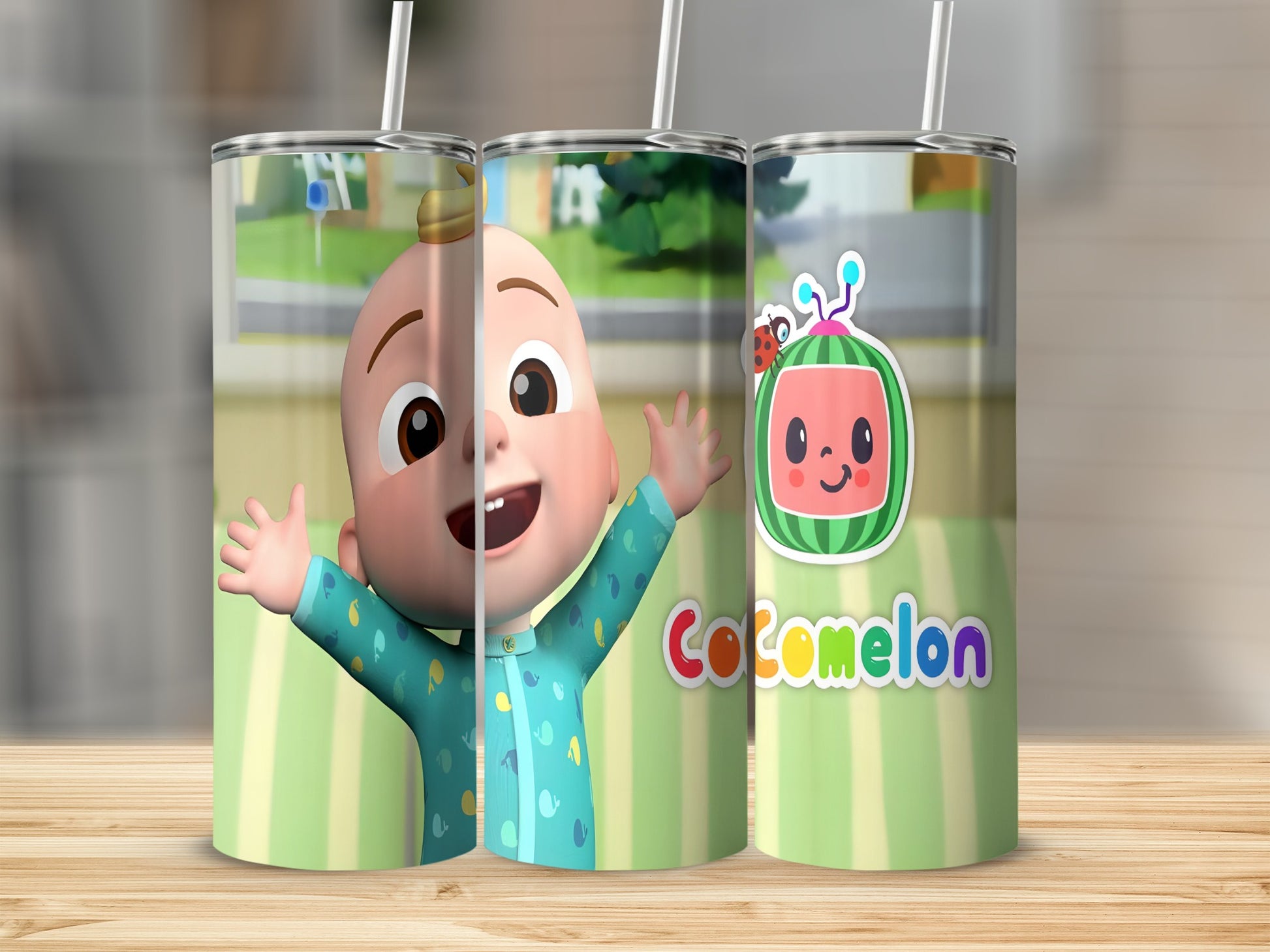 Cocomelon tumbler with a character and logo on a wooden surface.