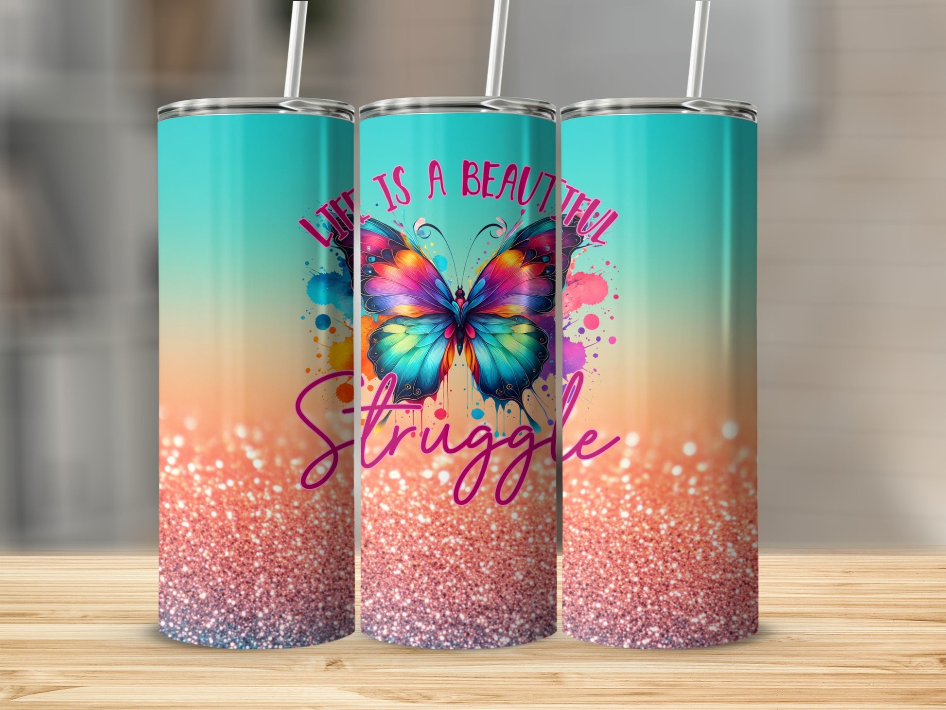 Tumbler with colorful butterfly and "Life is a beautiful struggle" text.
