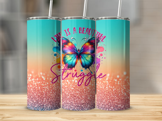 Tumbler with colorful butterfly and "Life is a beautiful struggle" text.