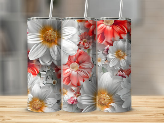 Three tumblers with white and red floral designs stand on a wooden surface.