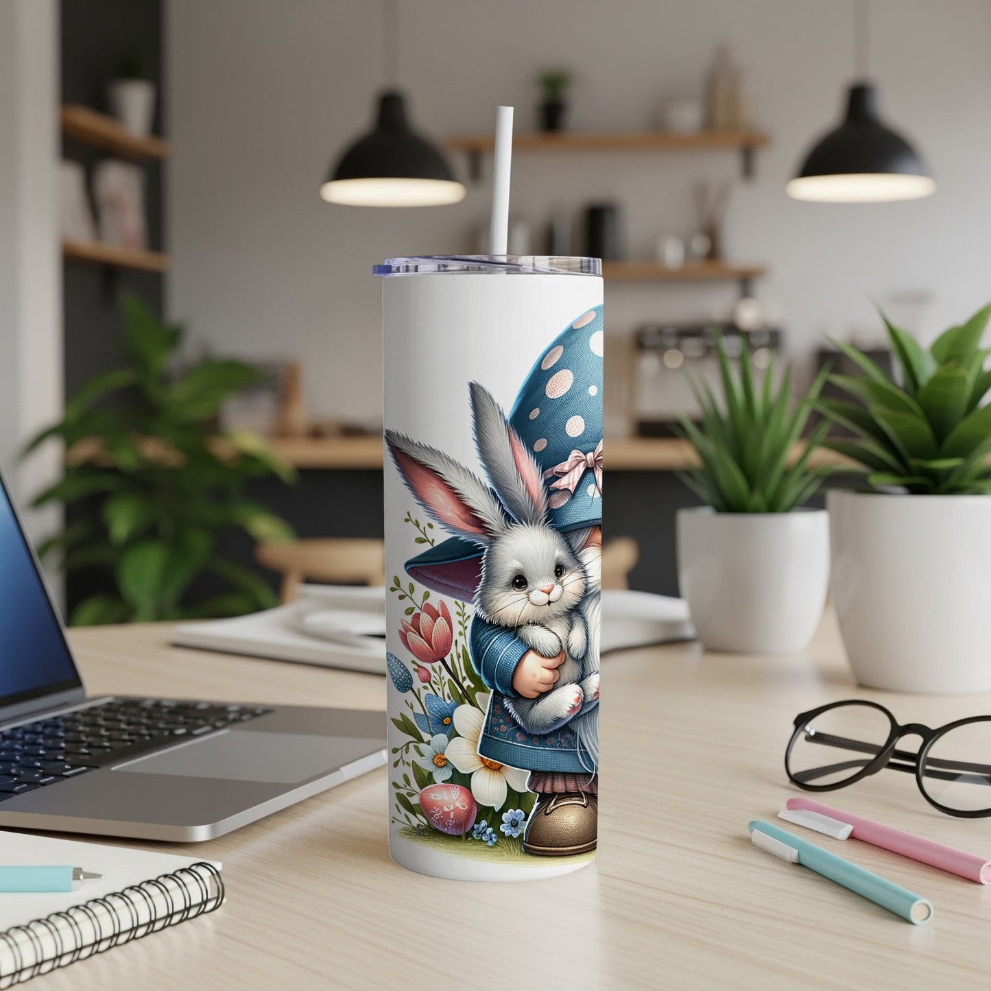 Easter bunny in blue hat with flowers on a white tumbler with a straw.
