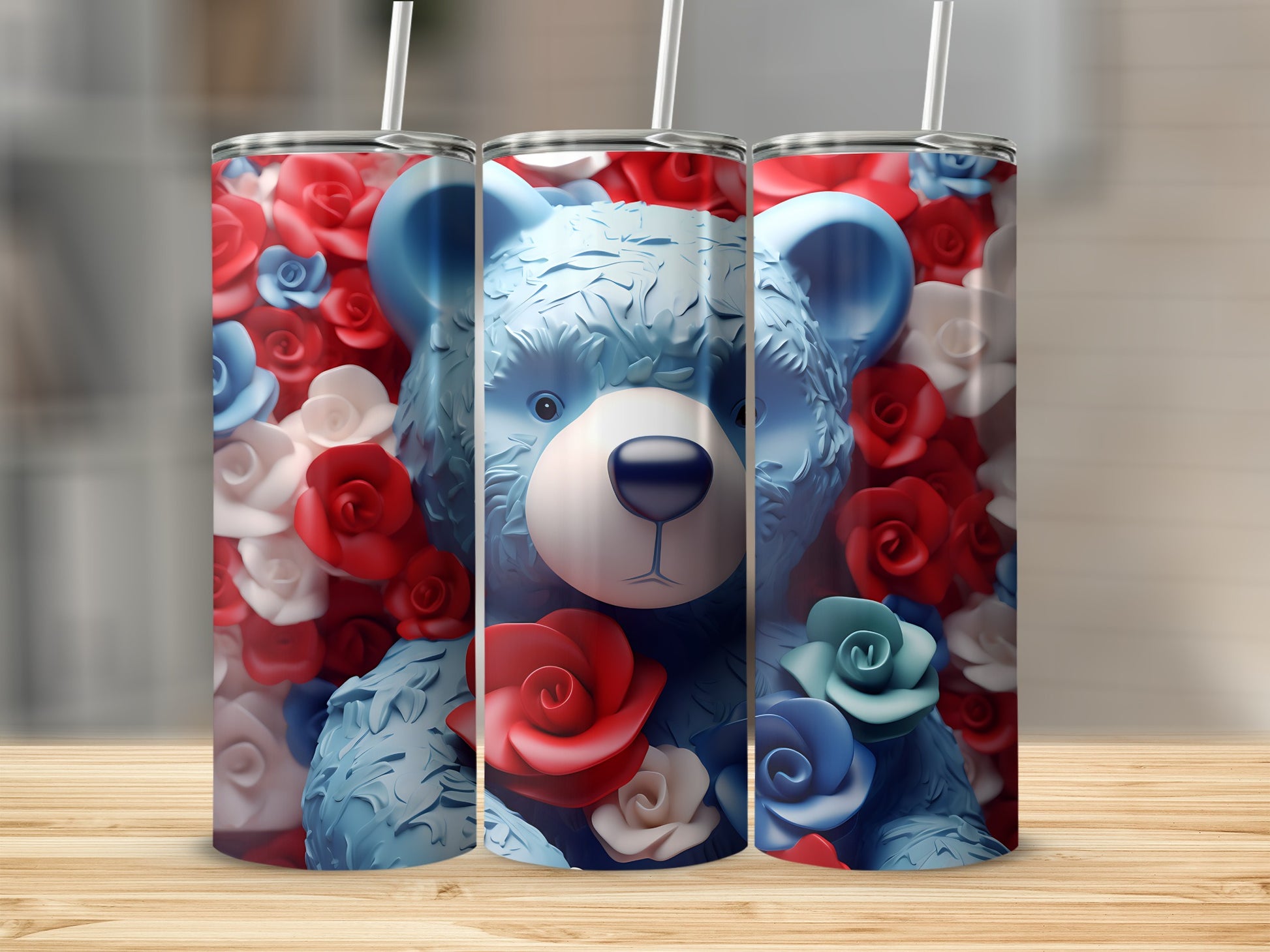 Three tumblers with a teddy bear and red and blue roses design.