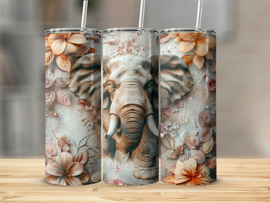 Elephant and floral pattern on three tumblers displayed on a wooden surface.