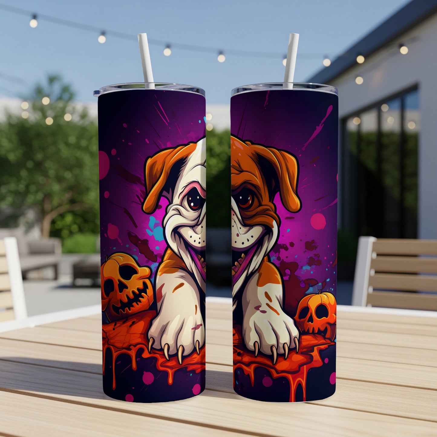 Two tumblers with a cartoon bulldog and pumpkins on a wood table.