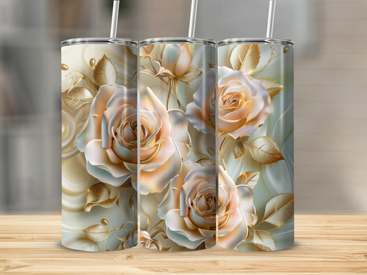 Three tumblers with a pale rose and gold leaf design on a wooden surface.