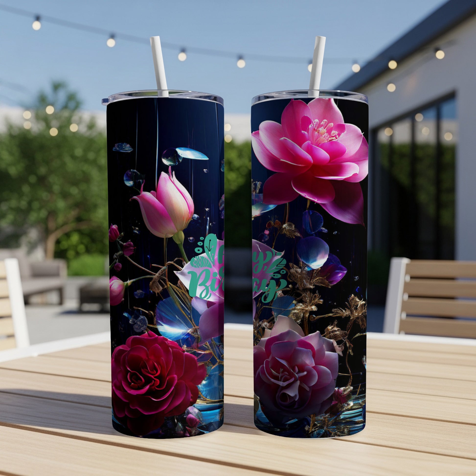 Two tumblers with pink and red flowers and "Blessed" text on a dark background.