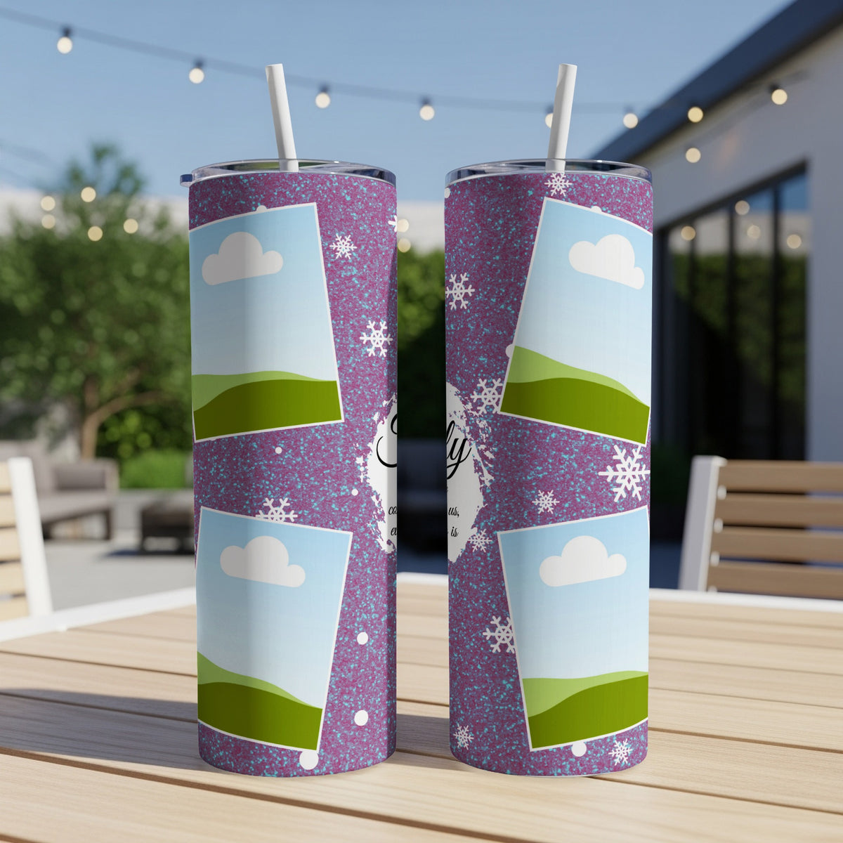 Purple tumbler with a speckled design, snowflakes, clouds, and green hills.