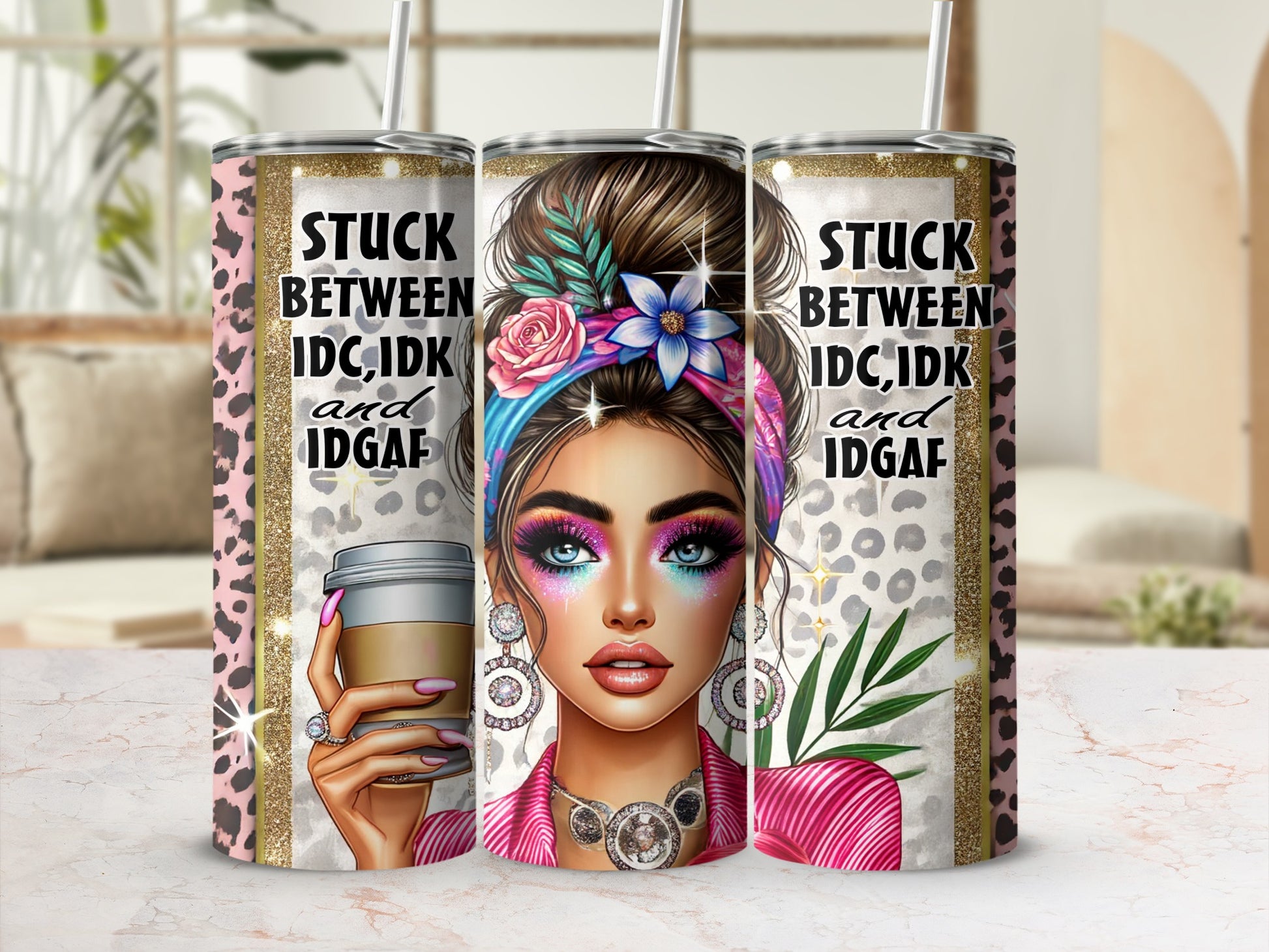 Pink leopard print tumbler with woman wearing colorful makeup and text "Stuck Between IDC, IDC, and IDGAF".