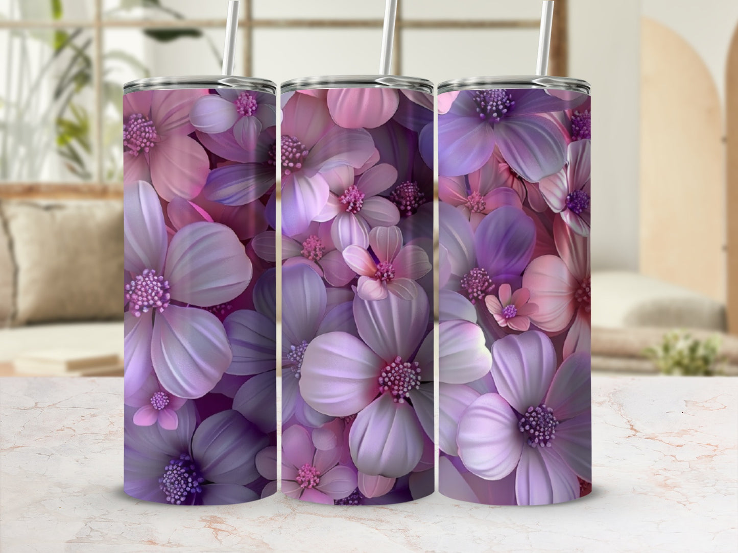 Three purple and pink floral tumblers with reusable straws.
