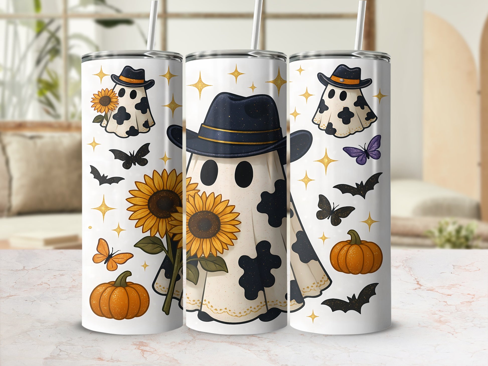 Three tumblers feature Halloween ghost designs with sunflowers, bats, and pumpkins.