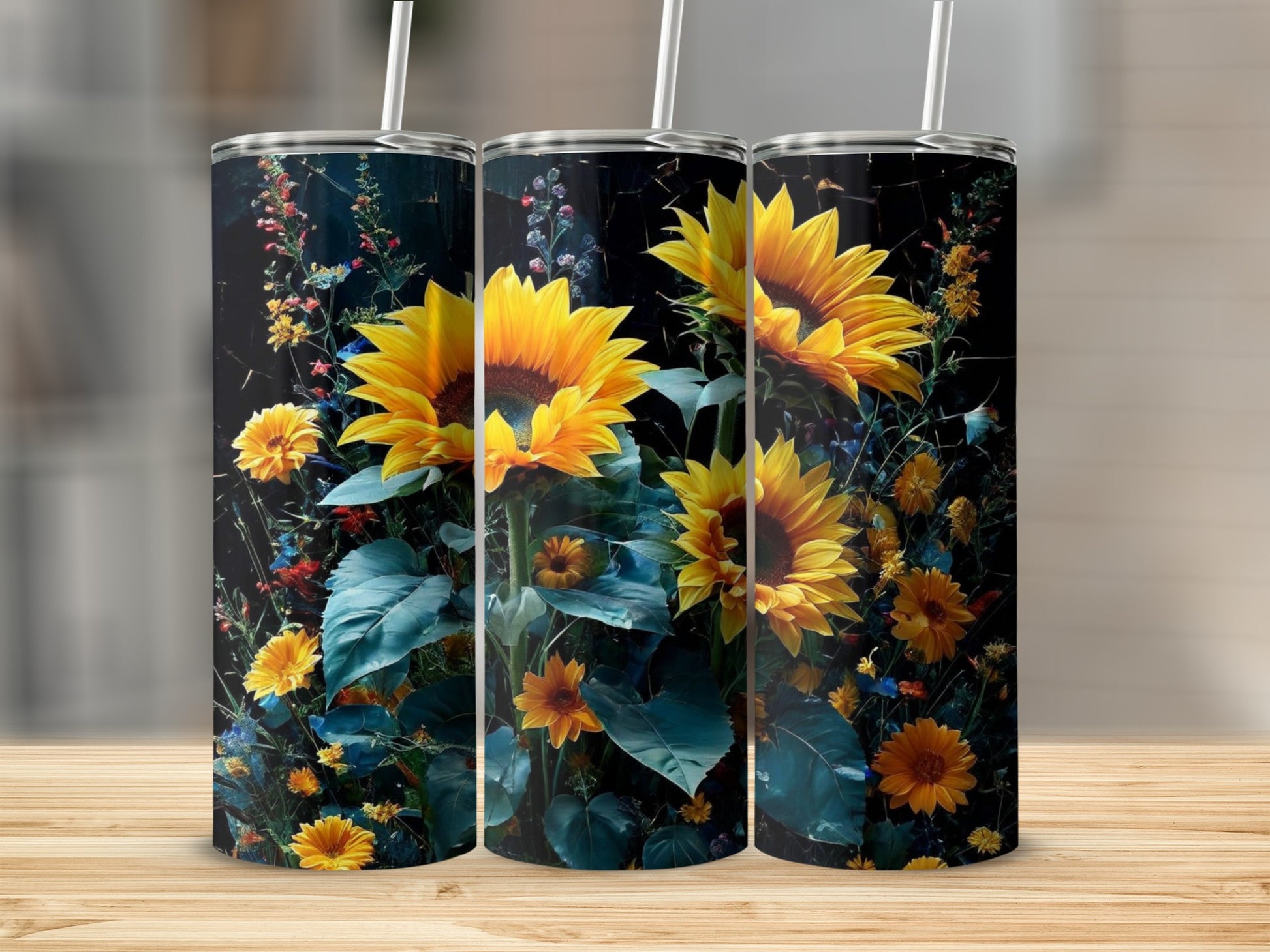 Three tumblers with sunflowers and dark floral background.