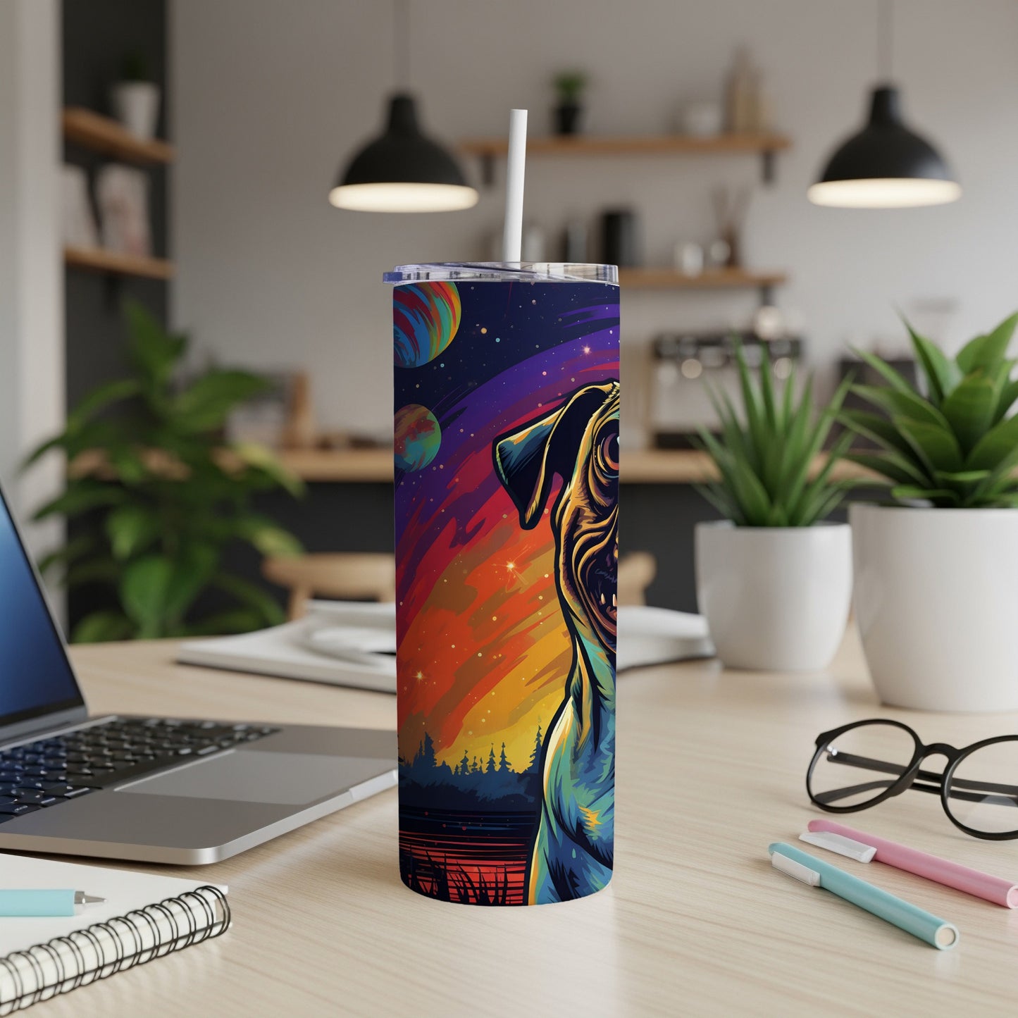 Tumbler with a colorful pug dog and planet design in a cosmic landscape.