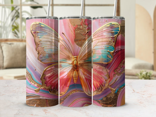 Three tumblers with a large golden butterfly and abstract colorful paint swirls.