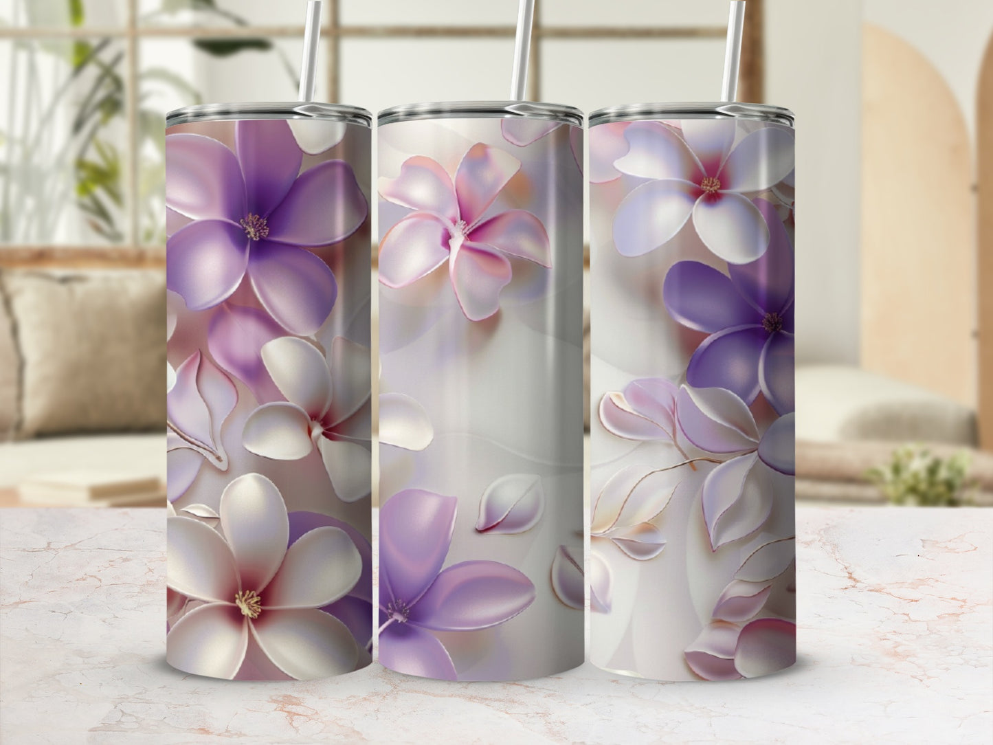 Three tumblers decorated with soft purple and white floral designs.
