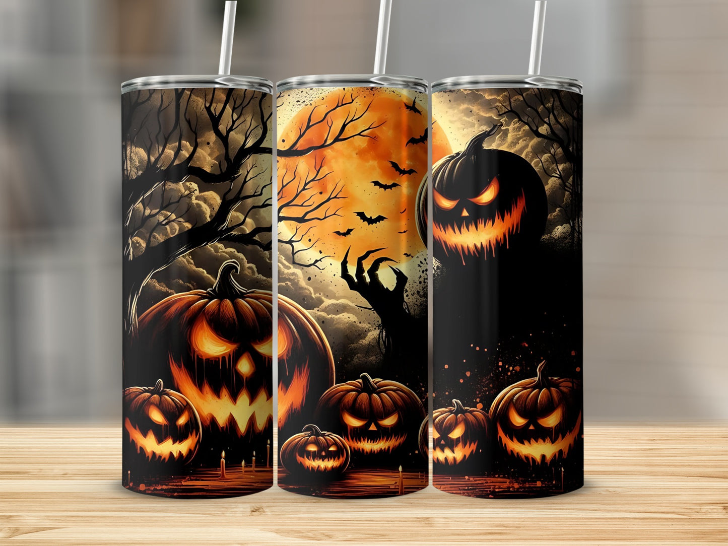 Three tumblers featuring a spooky Halloween scene with jack-o'-lanterns, bats, and a large moon.