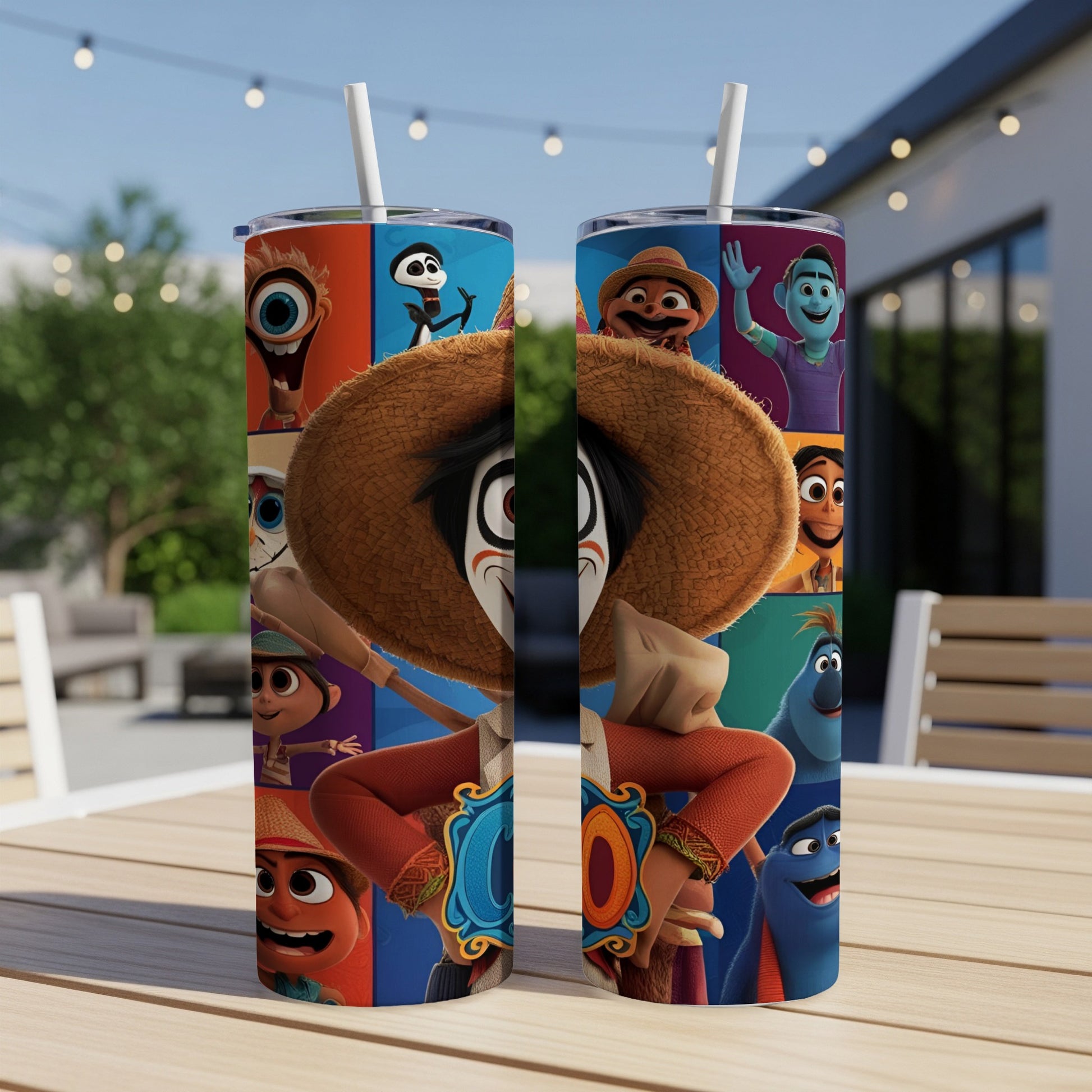Two tumblers with cartoon characters and a straw, resting on a table.