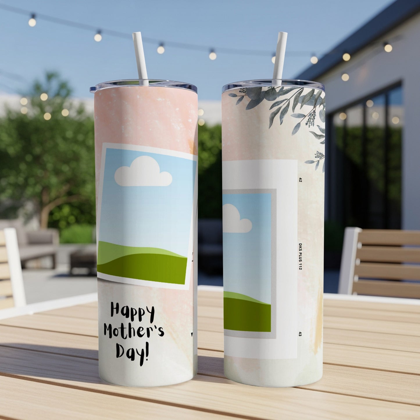 Two tumblers on a table, one with "Happy Mother's Day!" text and photo frames.