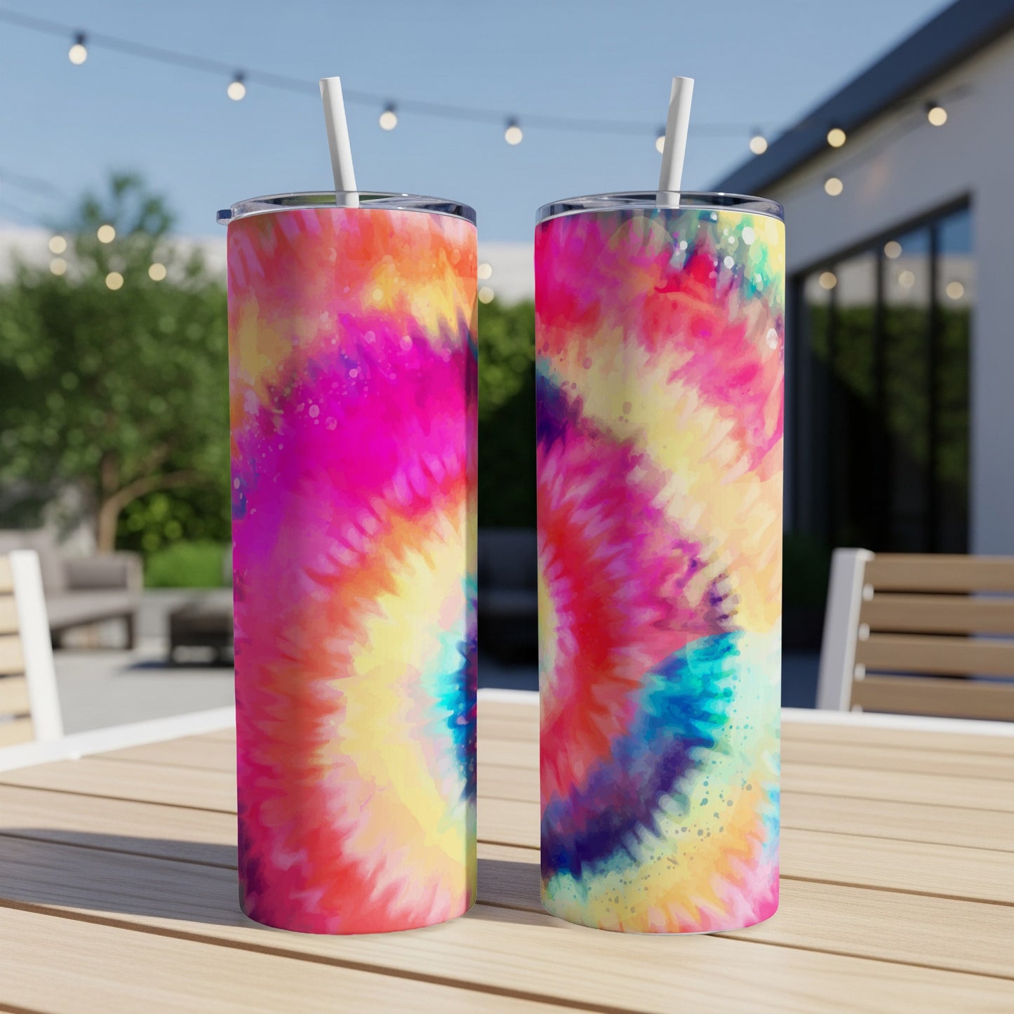 Two tumblers with colorful tie-dye patterns featuring pink, yellow, and blue.