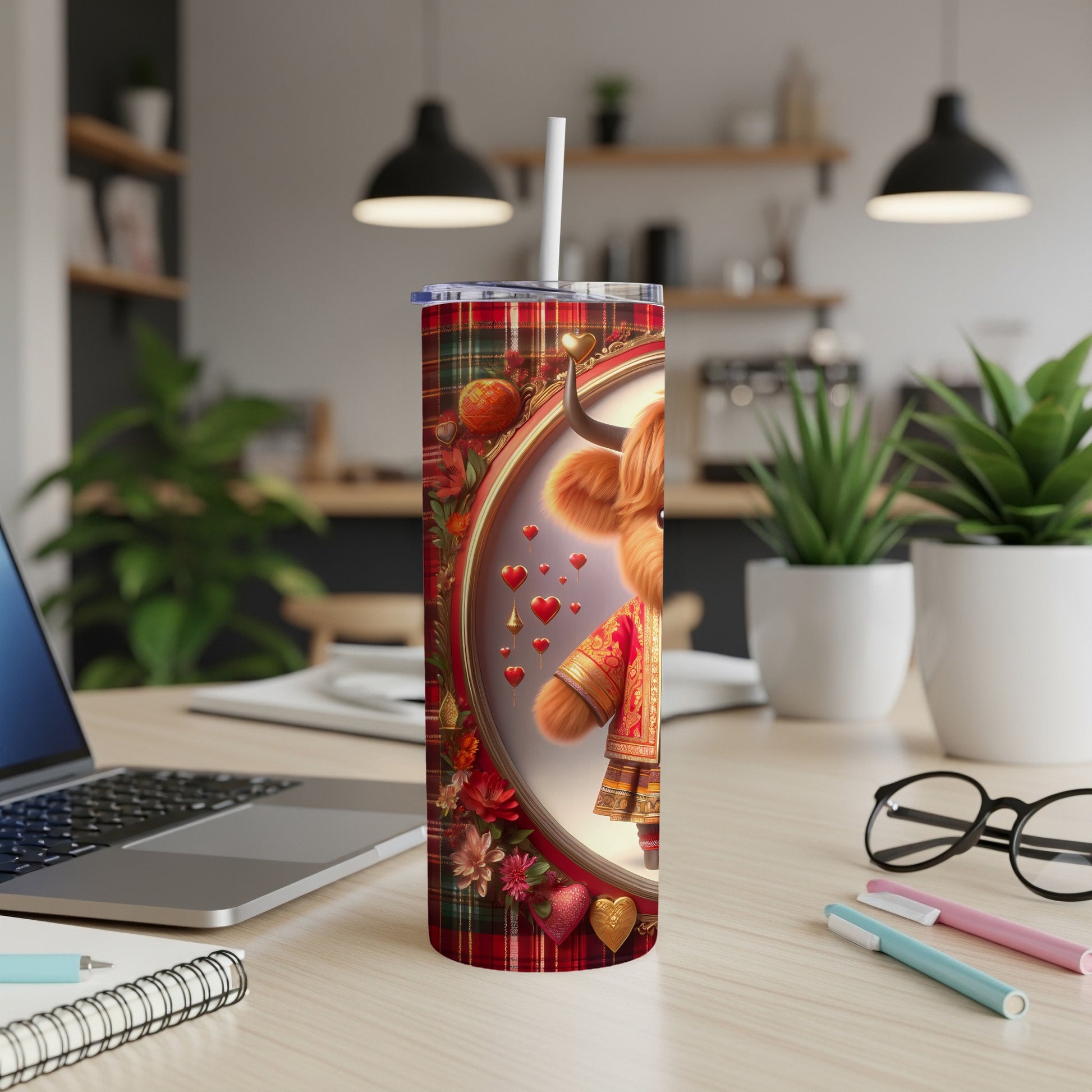 Highland cow in festive red and gold outfit with hearts on a tumbler.