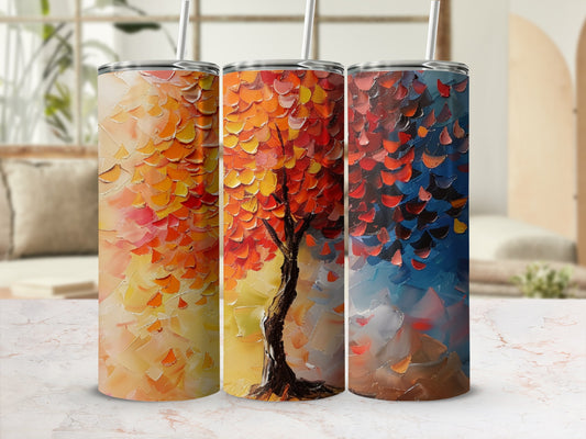 Three tumblers featuring an abstract painted tree with red, orange, and blue leaves.