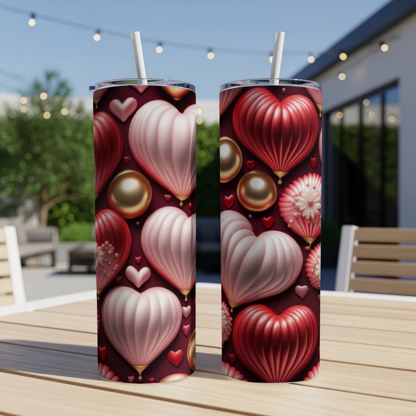 Two tumblers with a repeating pattern of textured hearts and gold spheres.