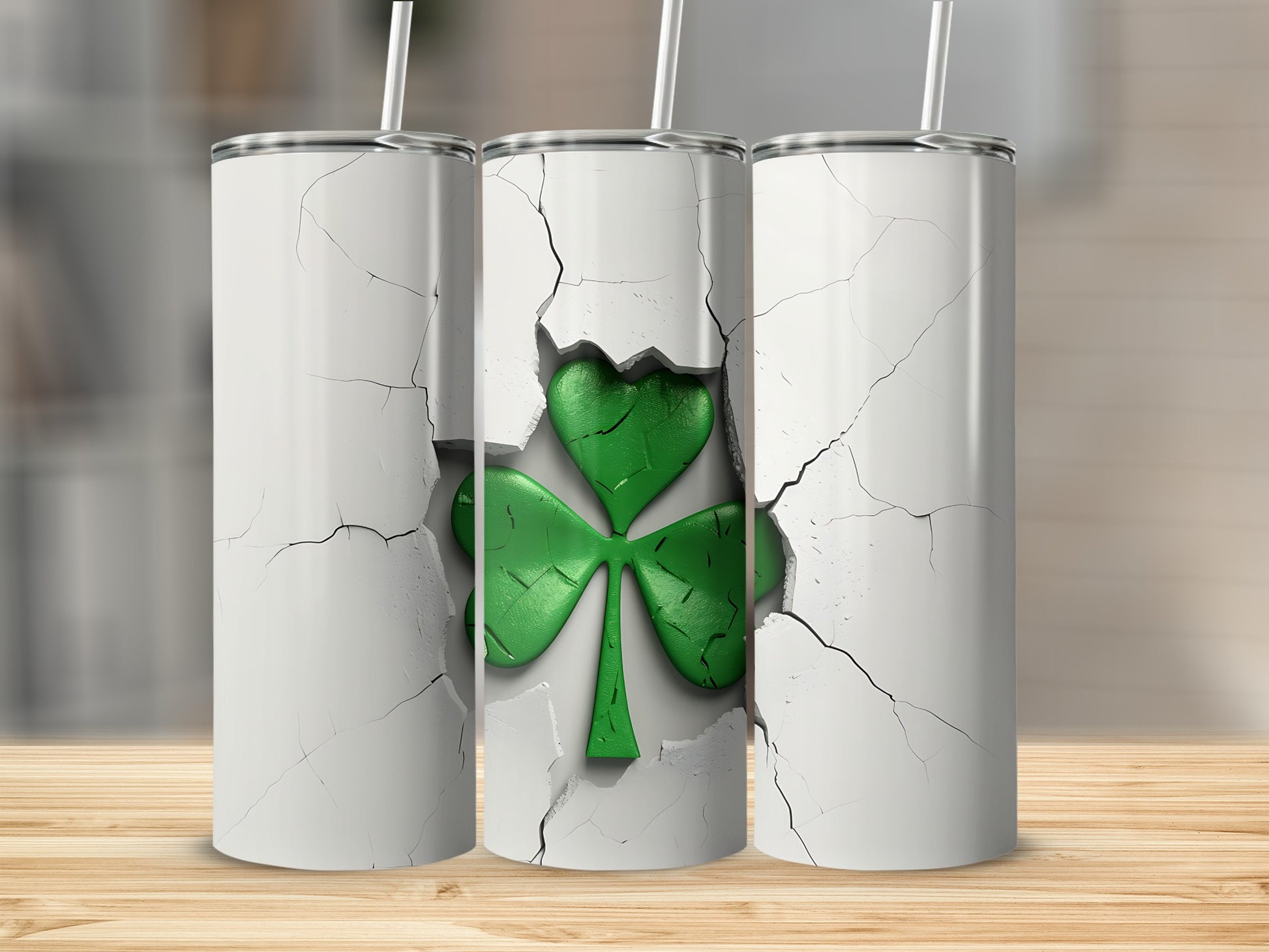 Three white tumblers with cracked texture revealing a green shamrock design.