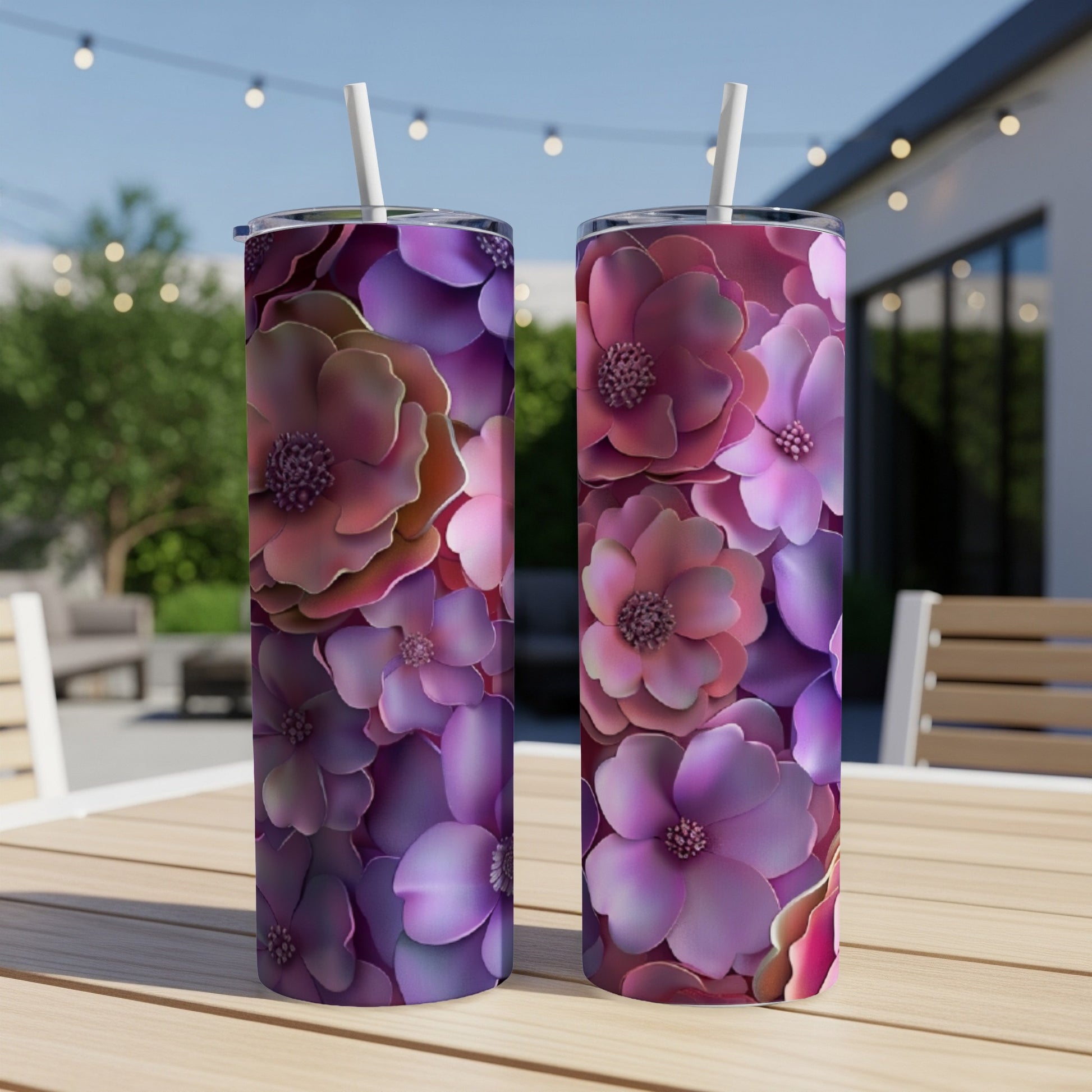 Two tumblers with a vibrant floral pattern of pink and purple flowers.