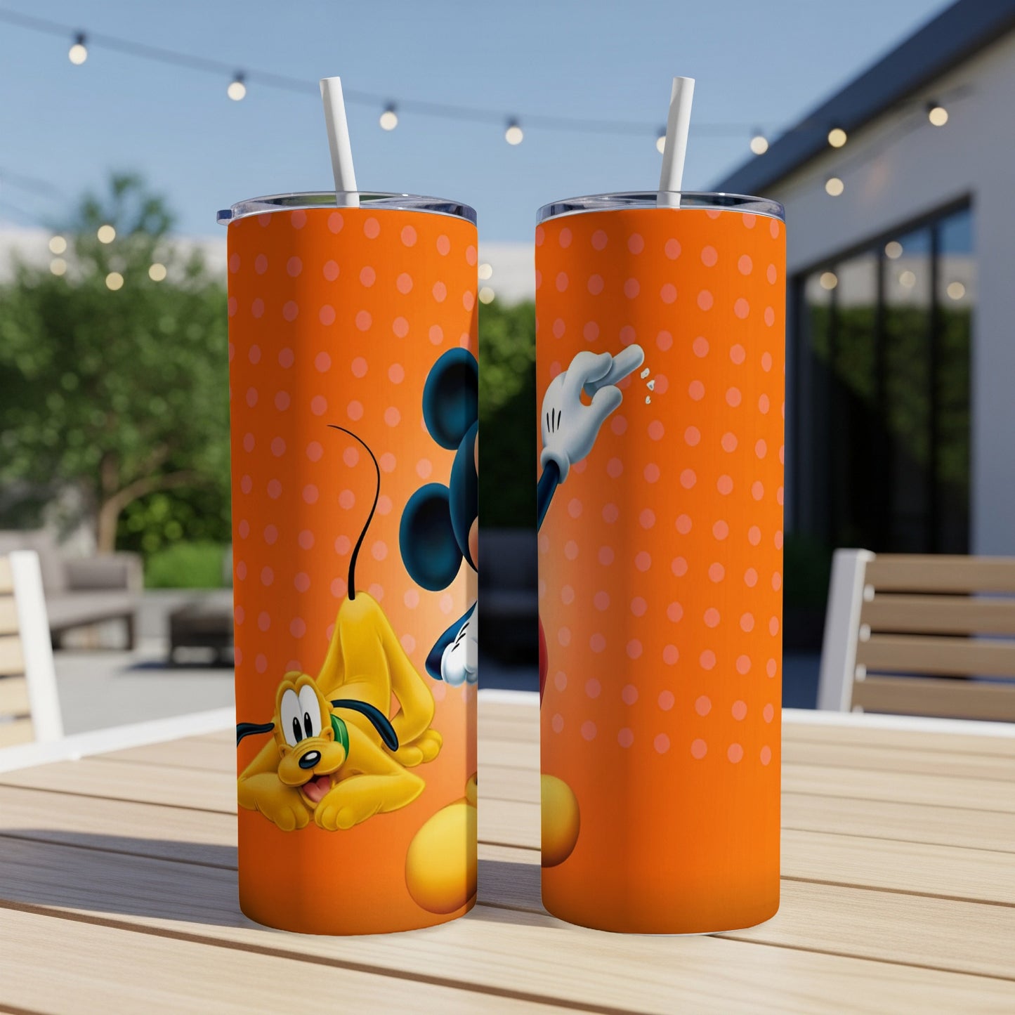 Mickey Mouse and Pluto on an orange tumbler with polka dots.