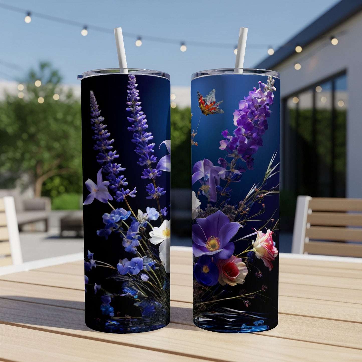 Two tumblers with floral and butterfly designs on a wooden table.