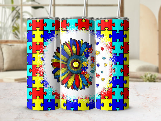 Sunflower tumbler with autism puzzle piece design.