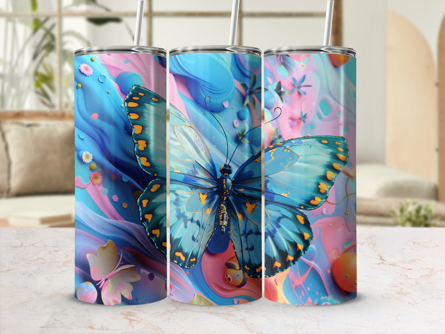 Three tumblers featuring a blue butterfly on a colorful, abstract background.