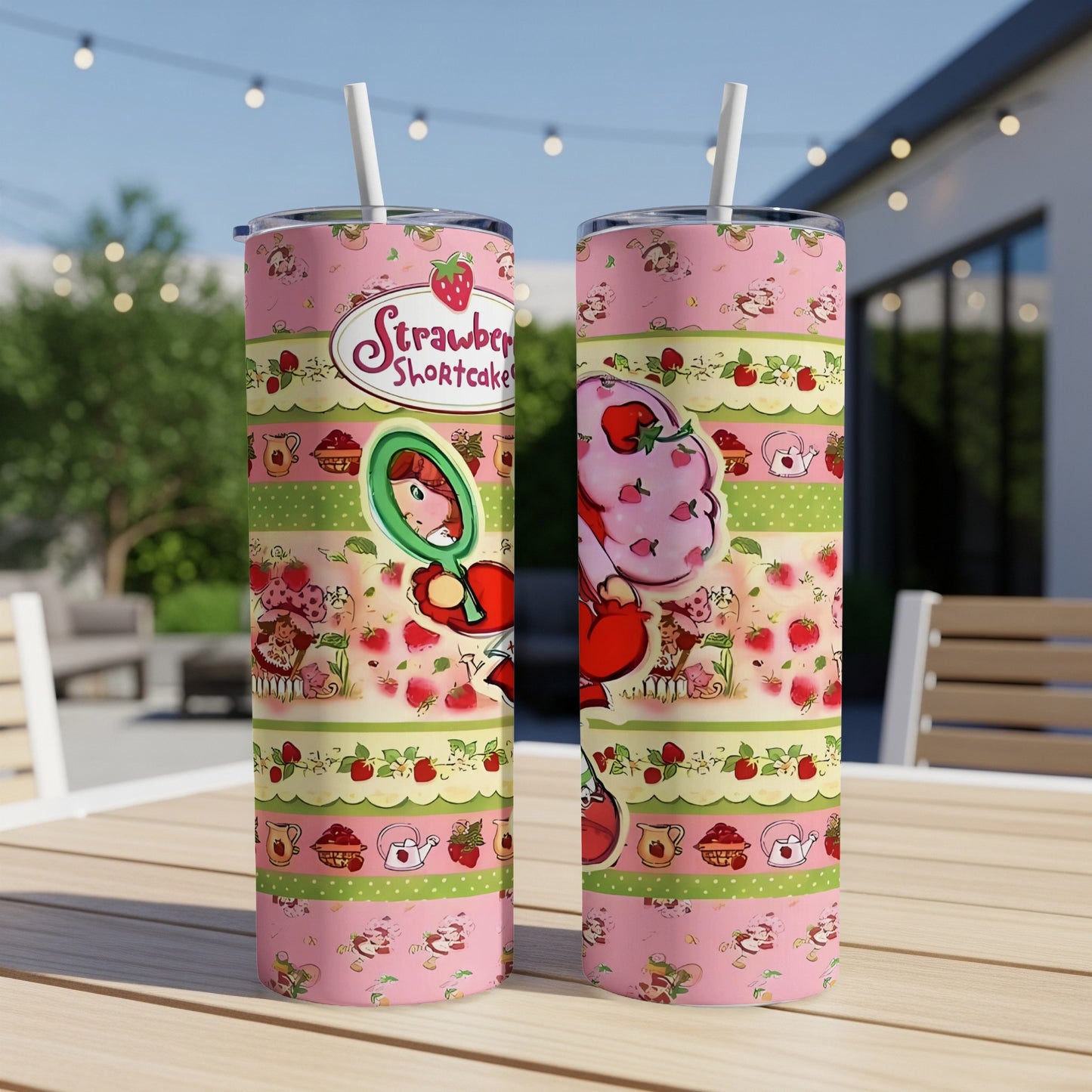 Strawberry Shortcake tumbler with playful, patterned design.