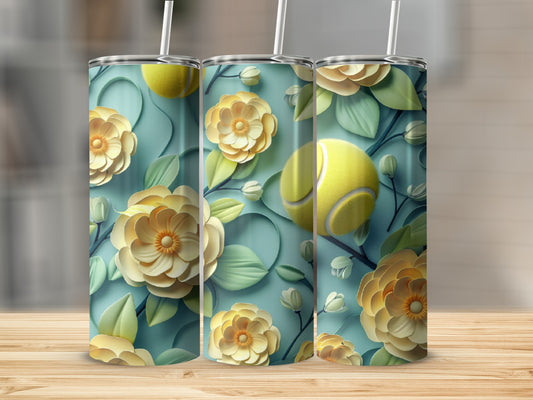 Three tumblers with a floral and tennis ball design on a wooden surface.