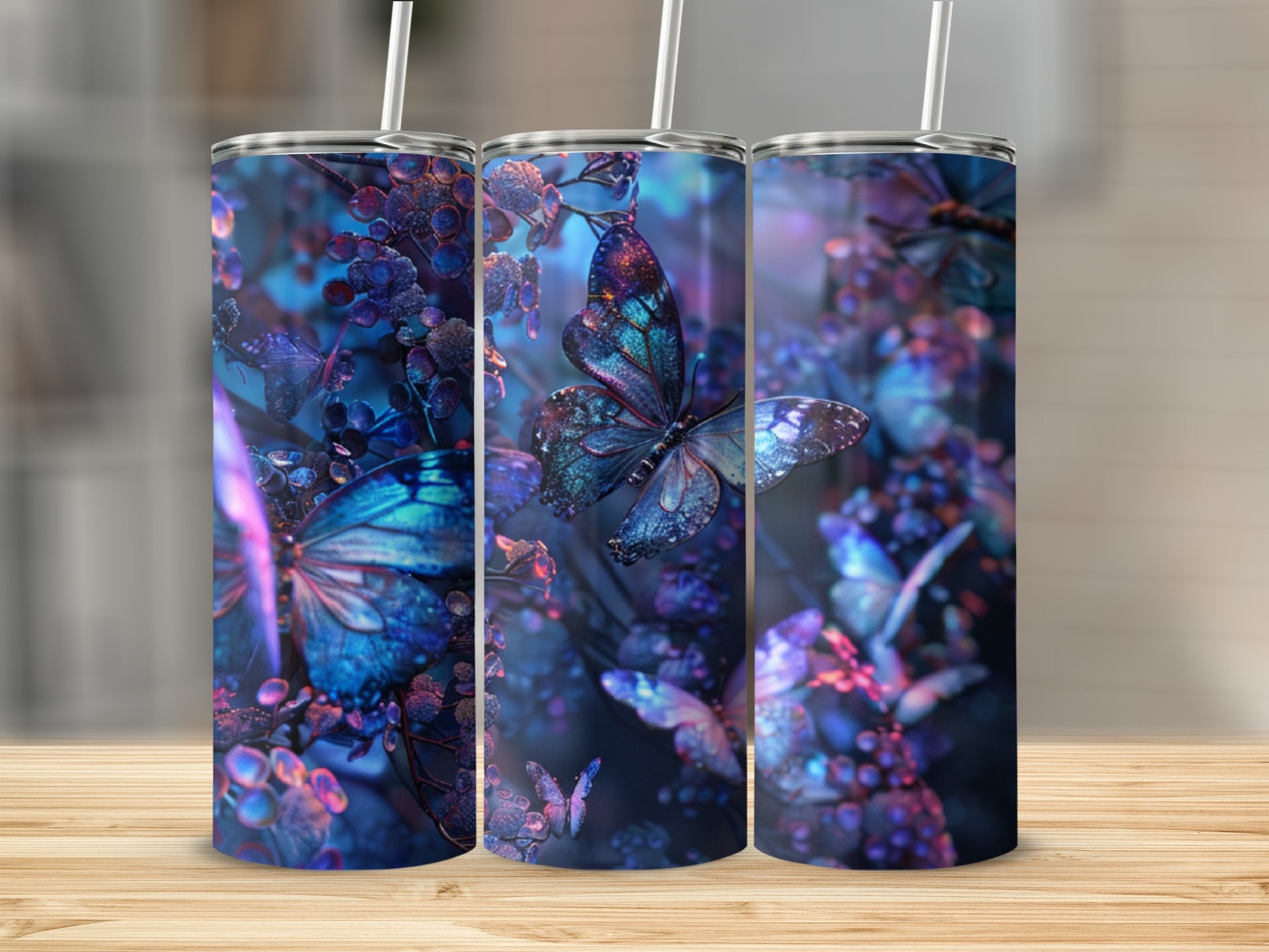 Three tumblers with iridescent butterfly and floral designs.