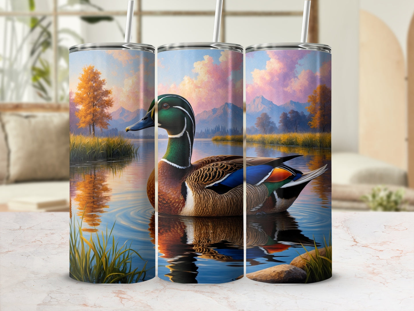 Mallard duck swimming on a lake with autumn trees and mountains in background.