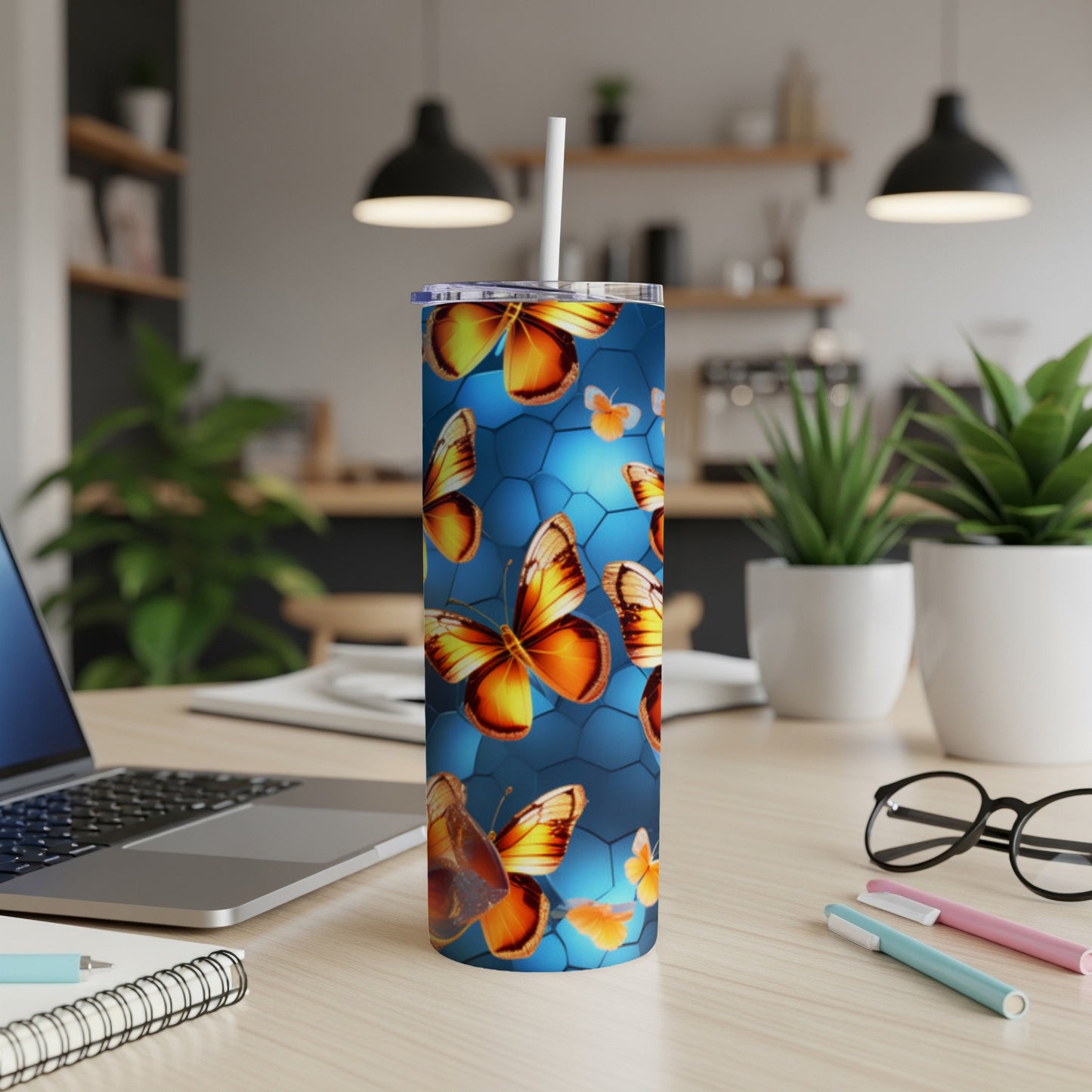 Tumbler with iridescent butterflies on blue honeycomb pattern.