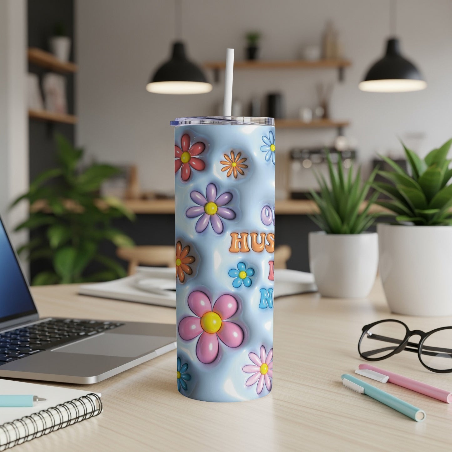 Blue tumbler with colorful flowers and text "Husband I Love You".