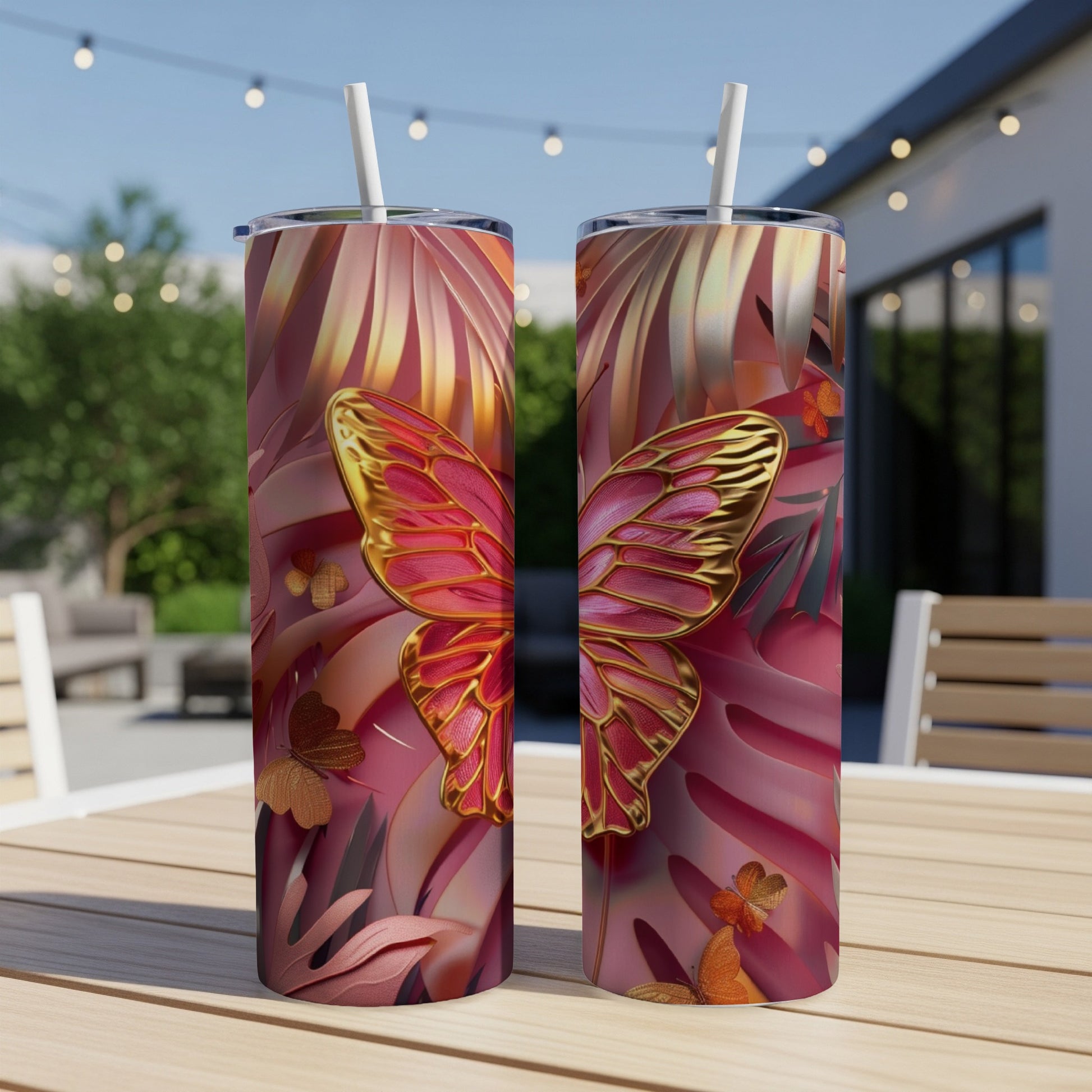 Two pink and gold butterfly tumblers with tropical leaf pattern.