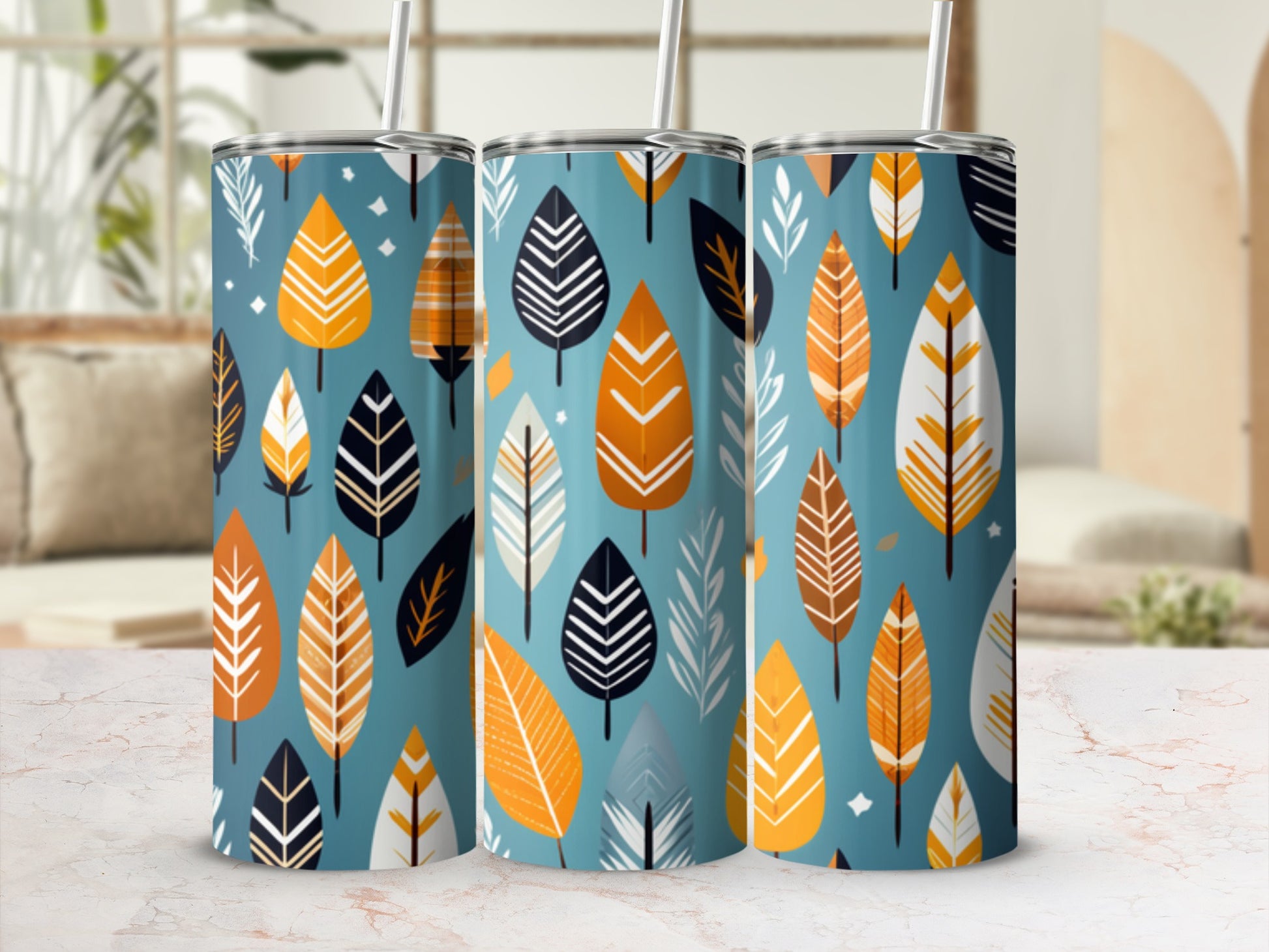 Three tumblers with a repeating pattern of stylized leaves in teal, orange, and white.