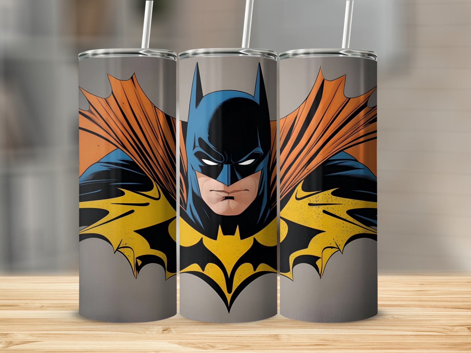 Batman superhero graphic on a grey tumbler with orange cape.