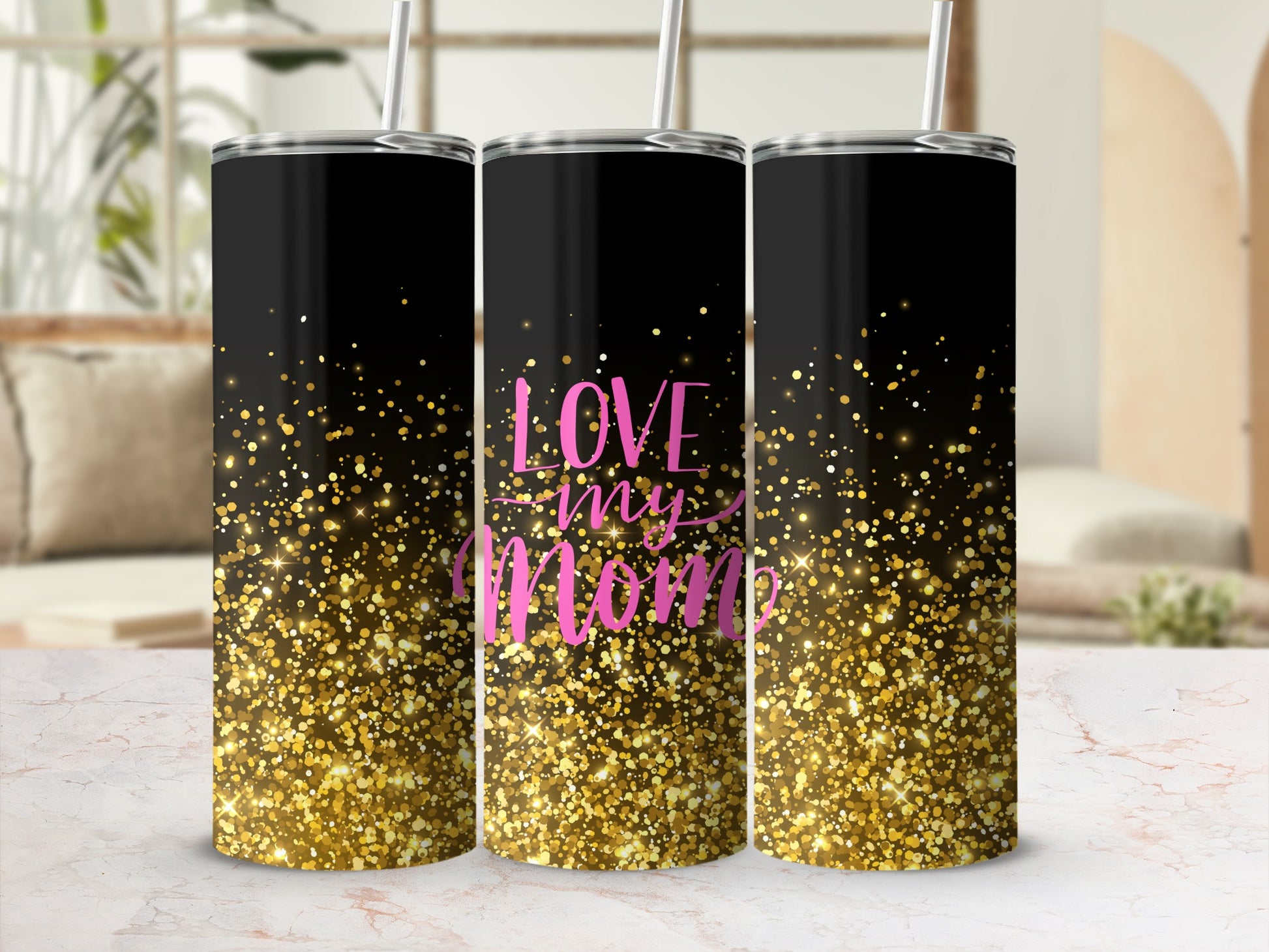 Black tumbler with pink "Love my Mom" text and gold glitter.