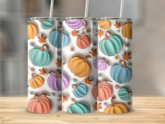 Three colorful, textured pumpkins on white background with subtle fall leaves.