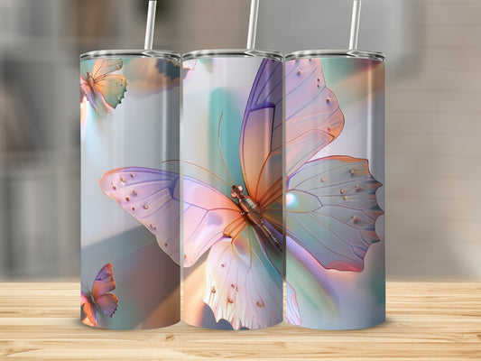 Three tumblers featuring iridescent butterfly designs and straws.