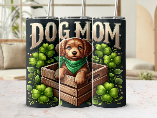 Dog Mom tumbler featuring a cute puppy in a wooden crate with shamrocks.