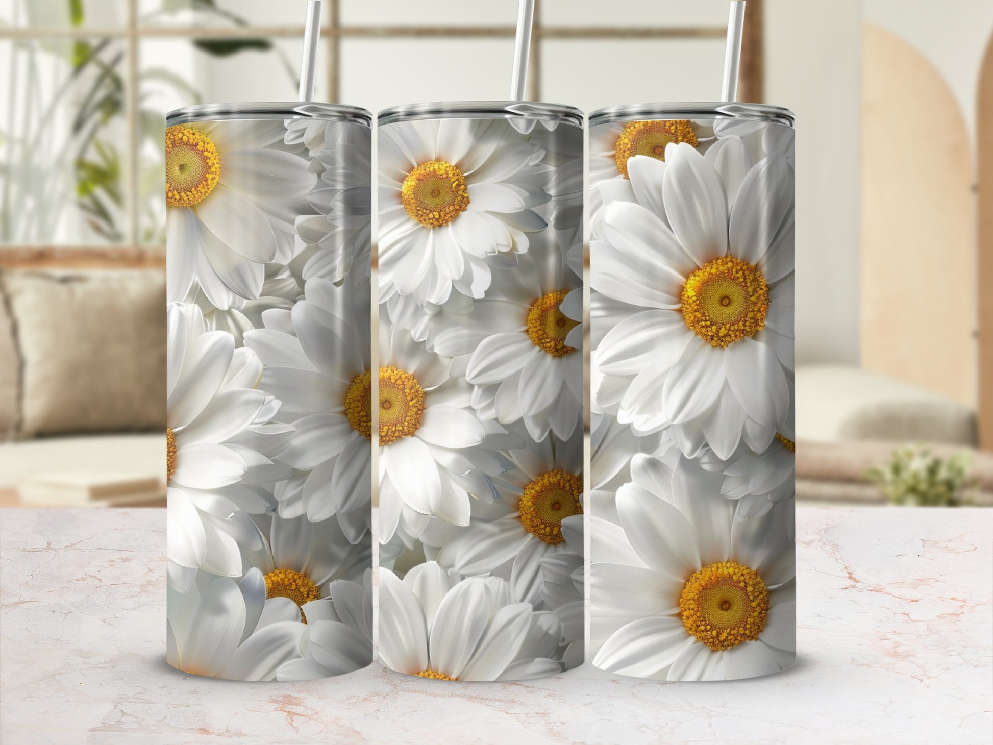 Three tumblers with a white daisy floral pattern, displayed on a textured surface.