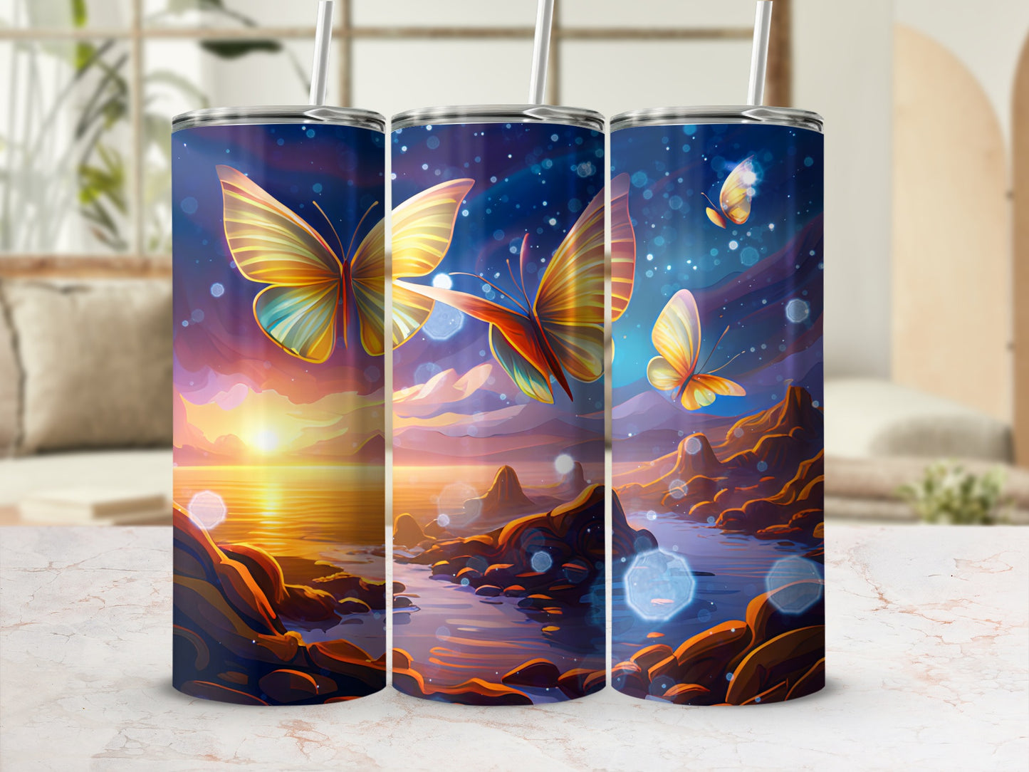 Three tumblers with butterfly and sunset landscape designs.
