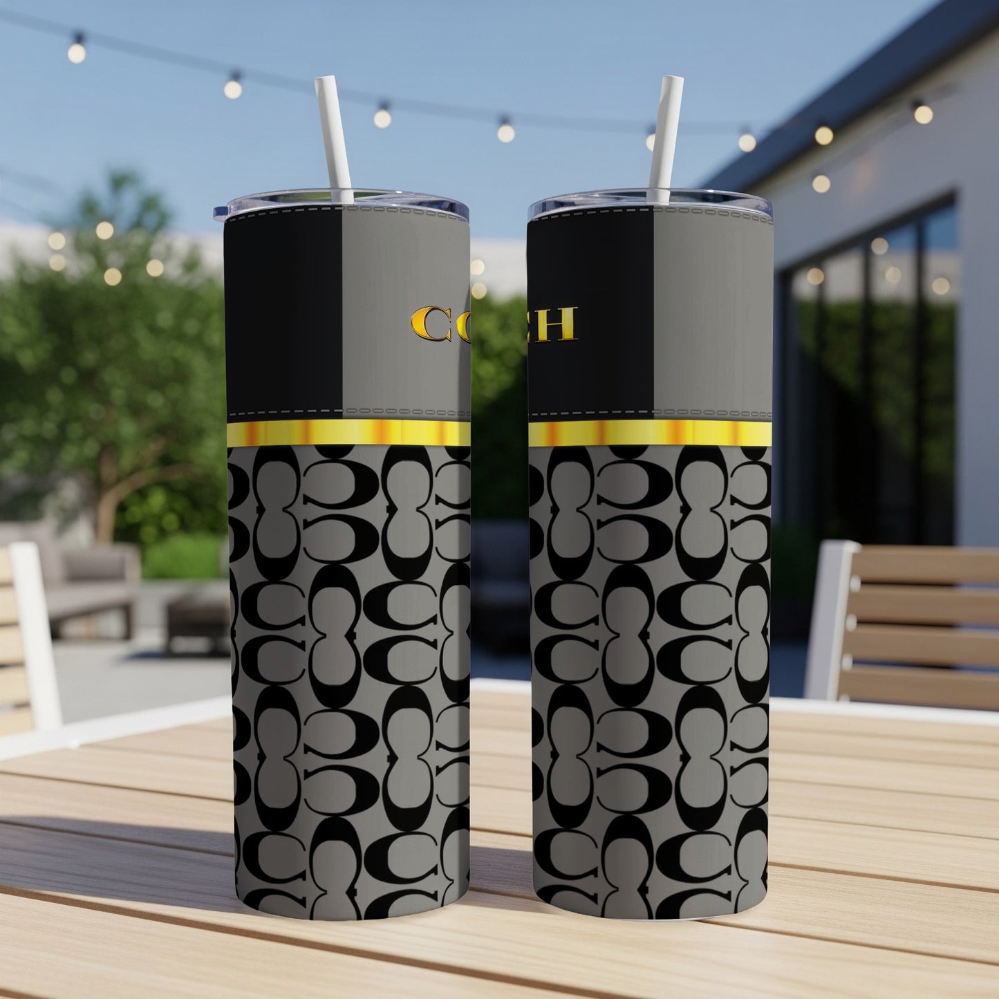 Two tumblers with a black and gray patterned design and gold lettering.