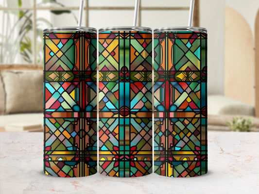 Three tumblers with stained glass mosaic patterns on a marble surface.